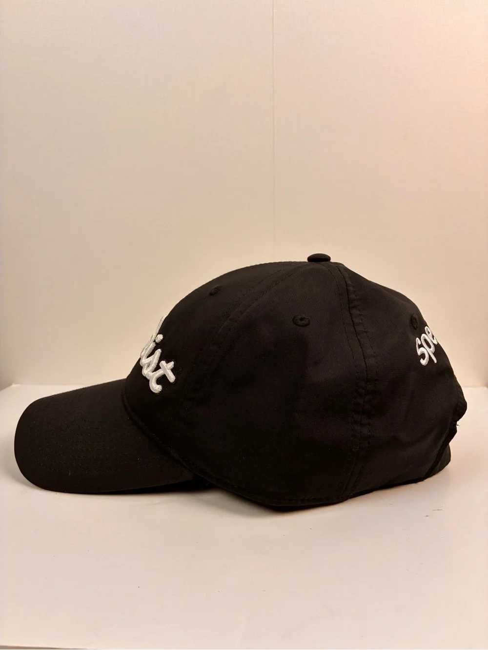Titleist Tour Performance hat featuring embroidered Spectrum on the back OS